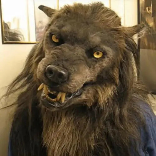 Realistic scary Halloween wolf mask with lifelike fur, piercing yellow eyes, and snarling mouth.